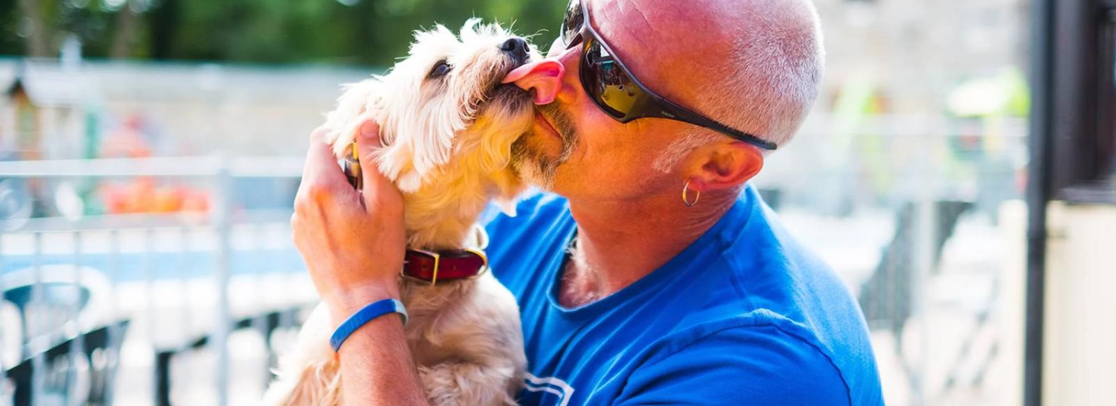 A man and his beloved pet dog on holiday