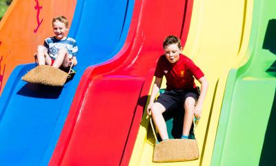 Kids having great fun at the funfair at Clarach Bay Holiday Village